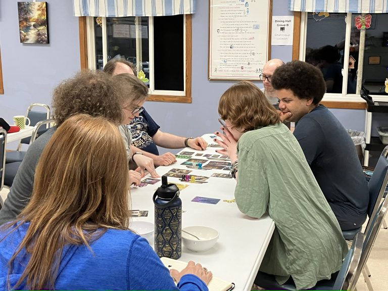 teens playing a board game